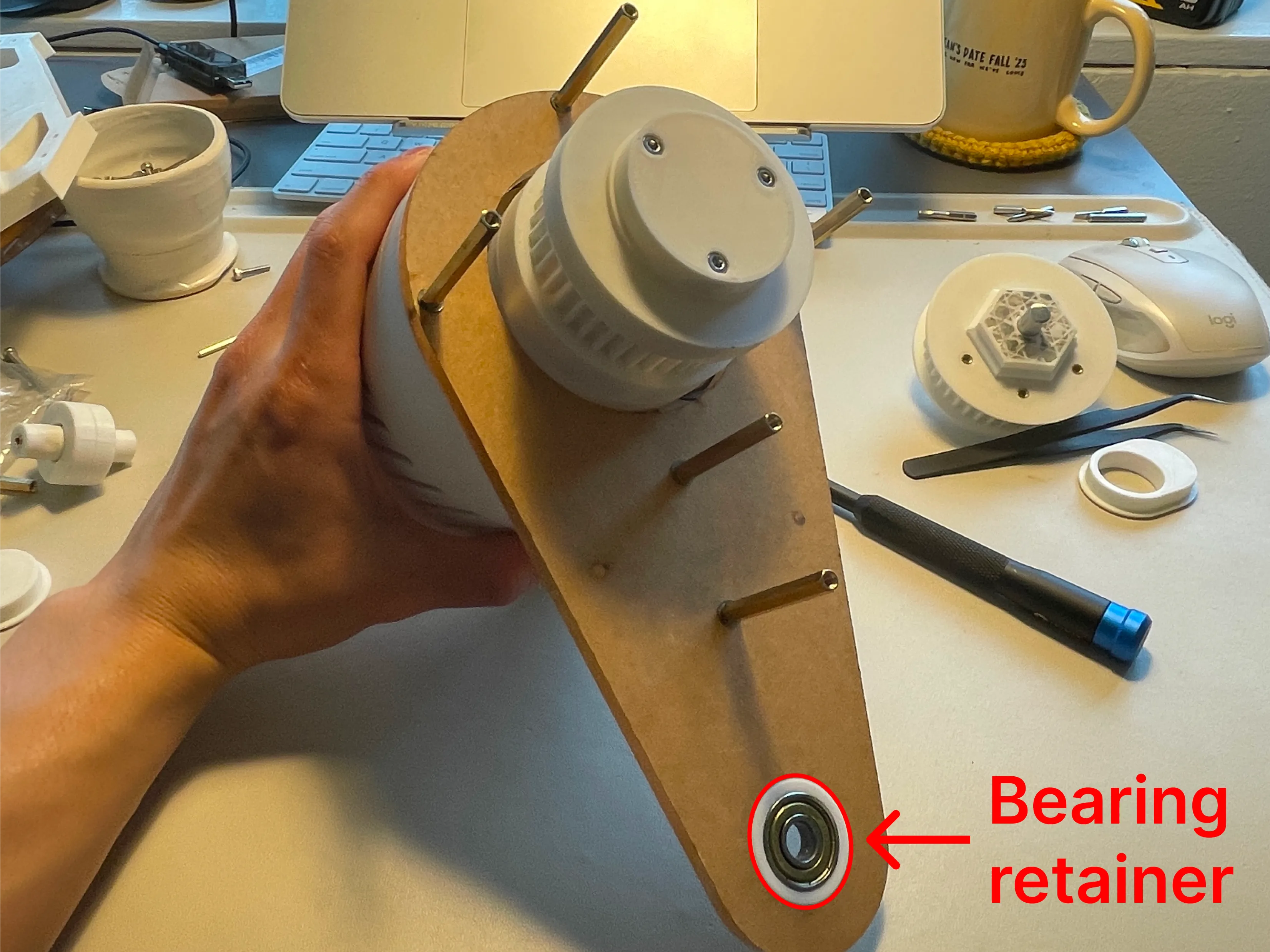3D-printed bearing retainer fitted into the laser-cut knee plate
