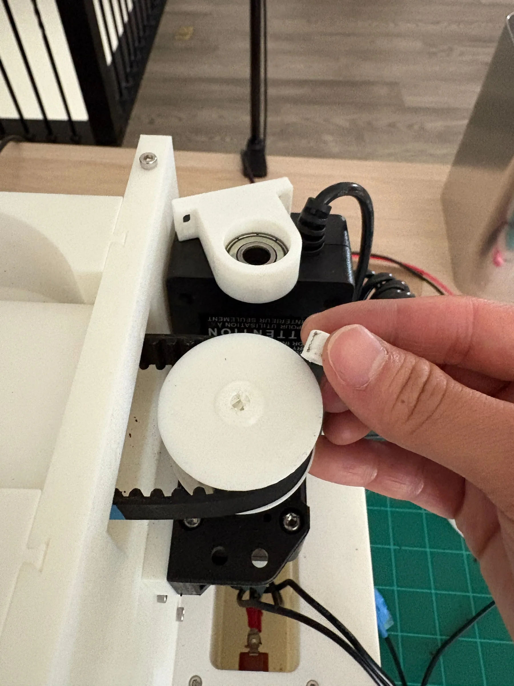 The failed motor-side setup: belt tension sheared material off the motor shaft