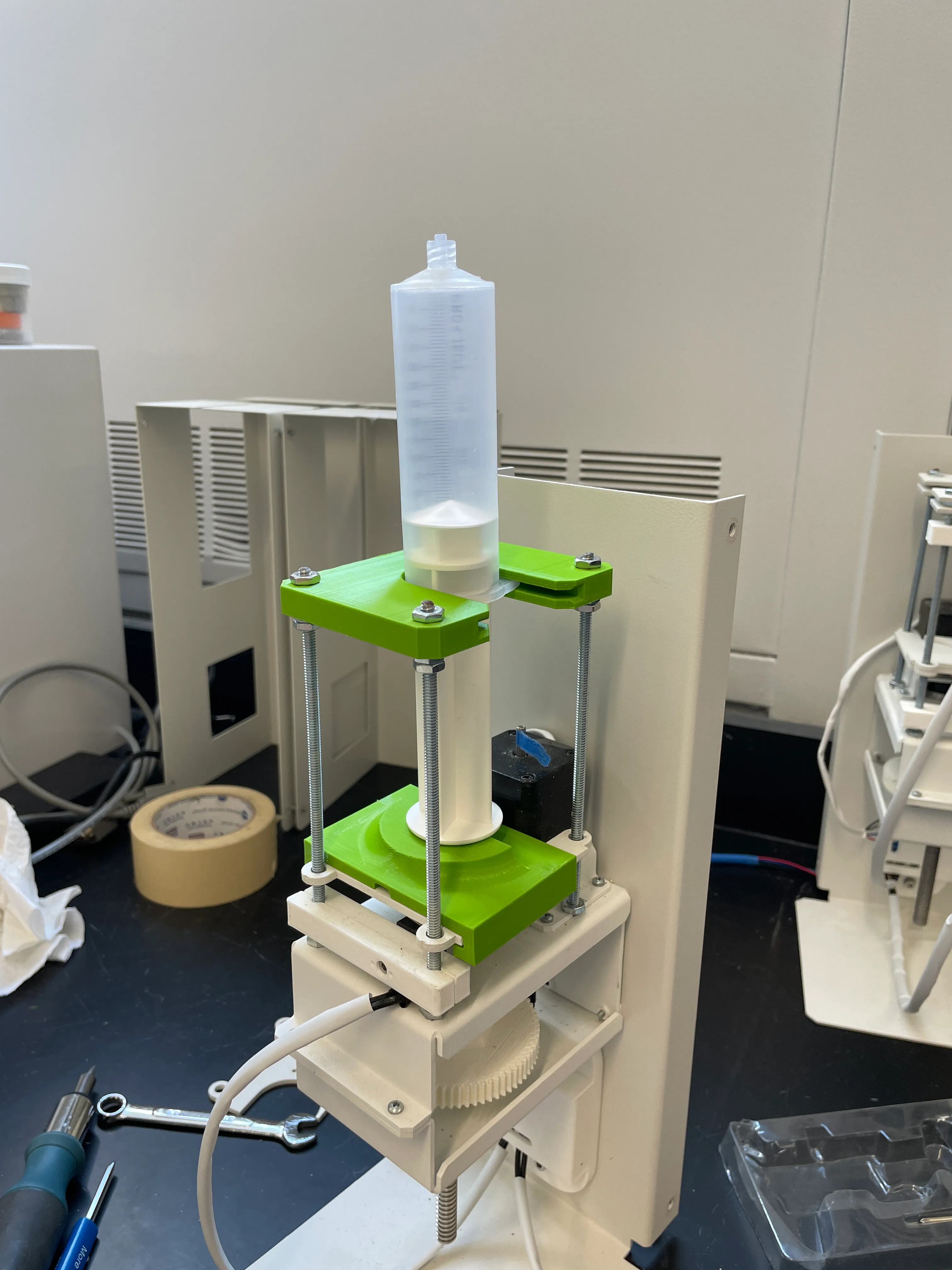 One of the two extruders used in the coaxial nozzle system